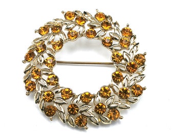 Orange rhinestone   Brooch   Yellow orange crystal   light gold tone metal mid century wreath pin