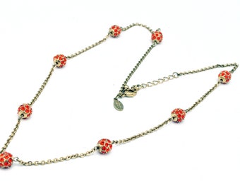 Nolan Miller Orange  Rhinestone ball Goldtone necklace