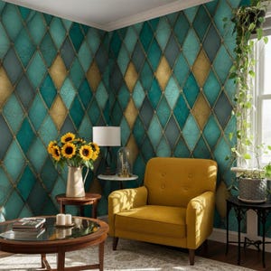 May include: A mustard yellow armchair sits in front of a wall with a teal and gold diamond pattern wallpaper. A round wooden coffee table holds a vase of sunflowers and two white candles. A tall green plant stands in a gray pot near a window.