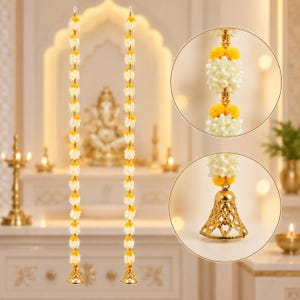 May include: Two vertical decorative garlands featuring alternating clusters of white and yellow artificial flowers separated by small gold-colored beads. Each garland terminates in a metallic gold-toned bell ornament at the bottom end.