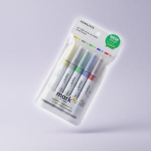 May include: A set of five Kokuyo Mark+ two-tone colour markers in a clear plastic retail package. Each marker features a white barrel with the text mark+ and a coloured cap. The packaging includes the brand name Kokuyo and Japanese text.