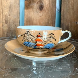Vintage Klimax Japanese tea set. Porcelain lustreware with stunning handpainted design. Five cups and saucers available. Sold separately.