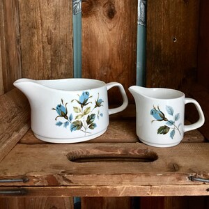 Alfred Meakin STUDIO pottery jugs/creamers in "Blue Roses" pattern. TWO available, sold separately. In good vintage condition.
