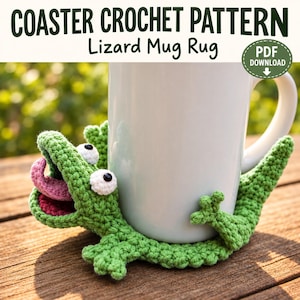 May include: A green crochet lizard mug rug coaster featuring a wide-open mouth with a pink tongue, white eyes with black pupils, and four small feet. The text reads COASTER CROCHET PATTERN Lizard Mug Rug and PDF DOWNLOAD.