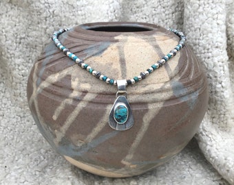 Genuine turquoise and sterling silver handmade pendant and beaded chain. Guys or women. Hammered silver finish. Western style jewelry.
