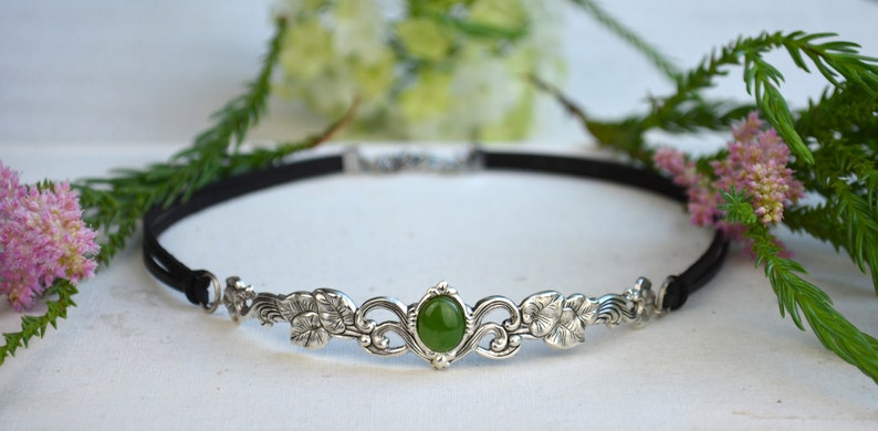 exquisite green jade stone Victorian choker necklace with a vegan leather strap. The stunning antique silver plated leaf design adds a touch of old-world charm to this boho style accessory.
