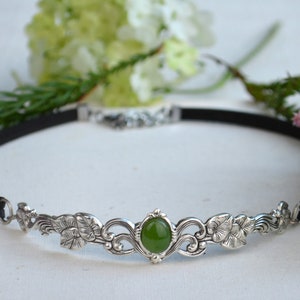 exquisite green jade stone Victorian choker necklace with a vegan leather strap. The stunning antique silver plated leaf design adds a touch of old-world charm to this boho style accessory.