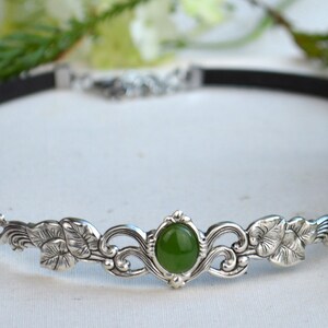 exquisite green jade stone Victorian choker necklace with a vegan leather strap. The stunning antique silver plated leaf design adds a touch of old-world charm to this boho style accessory.