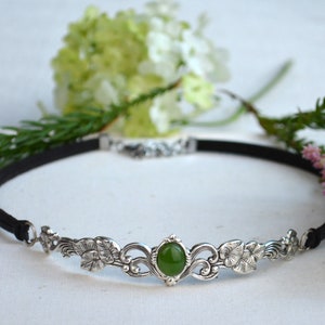 exquisite green jade stone Victorian choker necklace with a vegan leather strap. The stunning antique silver plated leaf design adds a touch of old-world charm to this boho style accessory.