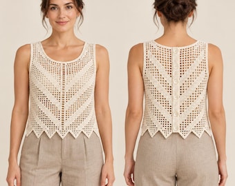 May include: A sleeveless cream-colored crochet top featuring an open-work grid pattern with chevron-style detailing. The back of the garment includes a vertical placket with five round buttons, and the hem has a pointed, scalloped edge.