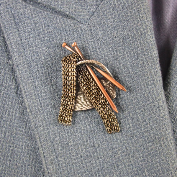 Broche de tejedor de cobre