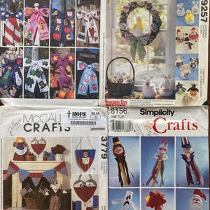 May include: Four different craft patterns for making festive decorations. The patterns include a variety of themes, such as patriotic, spring, and Halloween. The patterns are from McCall's and Simplicity Crafts.