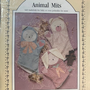 May include: A craft pattern for making animal-shaped oven mitts or washcloths. The pattern includes instructions for making a cat, bear, and bunny mitt. The pattern is from Prairie Farm Designs.