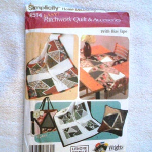 May include: A Simplicity home decorating pattern for a patchwork quilt and accessories. The package features images of a quilt, table runner, tote bag, and pillow with geometric designs in shades of red, green, and brown. The text "4514 EASY! Patchwork Quilt & Accessories" is visible.