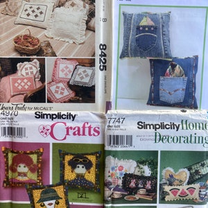 May include: Four different sewing patterns for making pillows. The patterns are from Simplicity and McCall's. The patterns include a variety of styles, including a patchwork pillow, a denim pillow, and a pillow with a whimsical face. The patterns are all for one size.