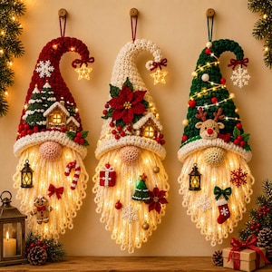 May include: Three hanging crochet gnome wall decorations with long white yarn beards and integrated warm LED string lights. Each gnome features a unique festive hat adorned with miniature houses, poinsettias, reindeer, and holiday ornaments.
