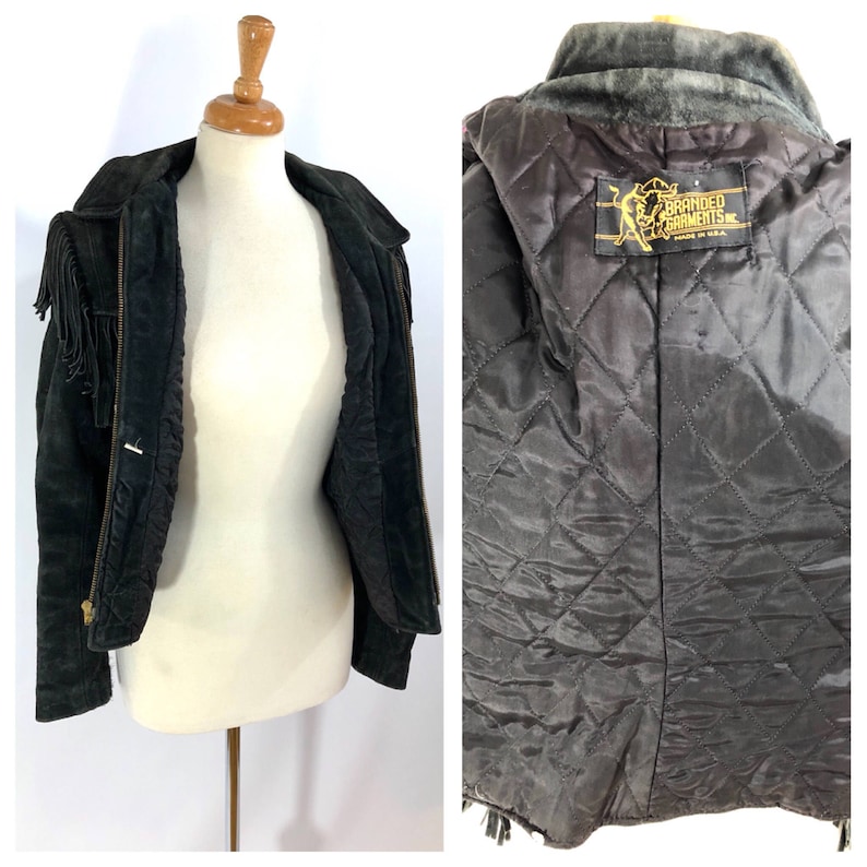 May include: Black suede fringe jacket with a zipper closure and a quilted lining. The jacket has a label that reads "Branded Garments Made in U.S.A."