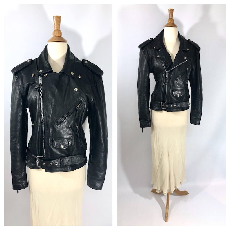 May include: Black leather motorcycle jacket with a zipper closure, a belt, and multiple pockets.
