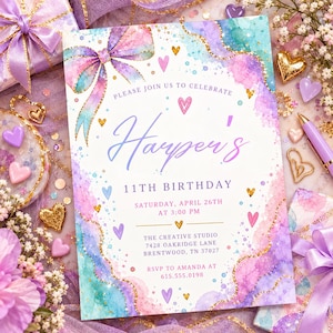 May include: A rectangular birthday invitation card featuring a watercolor design in shades of purple, pink, and teal with gold glitter accents. The card displays a large bow, heart icons, and text detailing Harper's 11th birthday celebration.