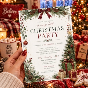 May include: A rectangular Christmas party invitation card featuring a dark red bow at the top, green pine branches, red berries, pinecones, and gold stars. The text reads: Please join us for a very little Christmas party, Saturday, December 18, 6:00 PM.