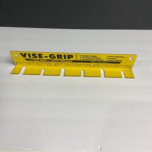 Vise-grip metal store display rack