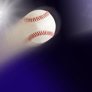 May include: A white baseball with red stitching is flying through the air, with a bright white light in the background.