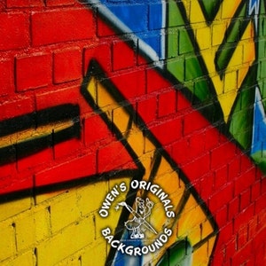 May include: A brick wall with colorful graffiti in red, yellow, green, and blue. The graffiti features geometric shapes and a logo that says "Owen's Originals Backgrounds".