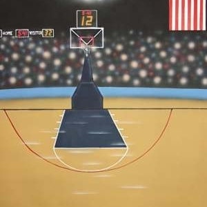 May include: A basketball court with a scoreboard showing the score as Home 54, Visitor 32, and the clock at 1:12. The court is empty except for a basketball hoop at center court. The court is lit by bright lights and there is a crowd of people in the background. An American flag is in the upper right corner of the image.