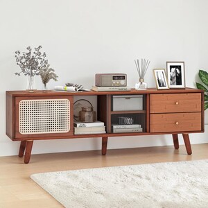 May include: A long, rectangular wooden media console featuring a sliding door with a light-colored woven cane panel, an open central shelving section, and two stacked drawers on the right side, all supported by four tapered wooden legs.