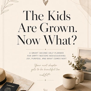 May include: A planner titled The Kids Are Grown. Now What? A Smart Second Half Planner for Empty Nesters. Includes a straw hat, passport, sunglasses, a ceramic mug, a small vase with greenery, and a notebook with a compass icon on the cover.
