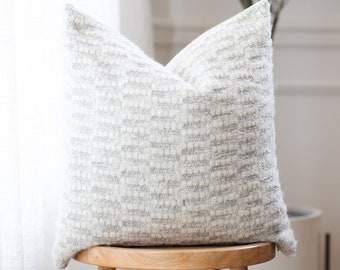 light gray lumbar pillow