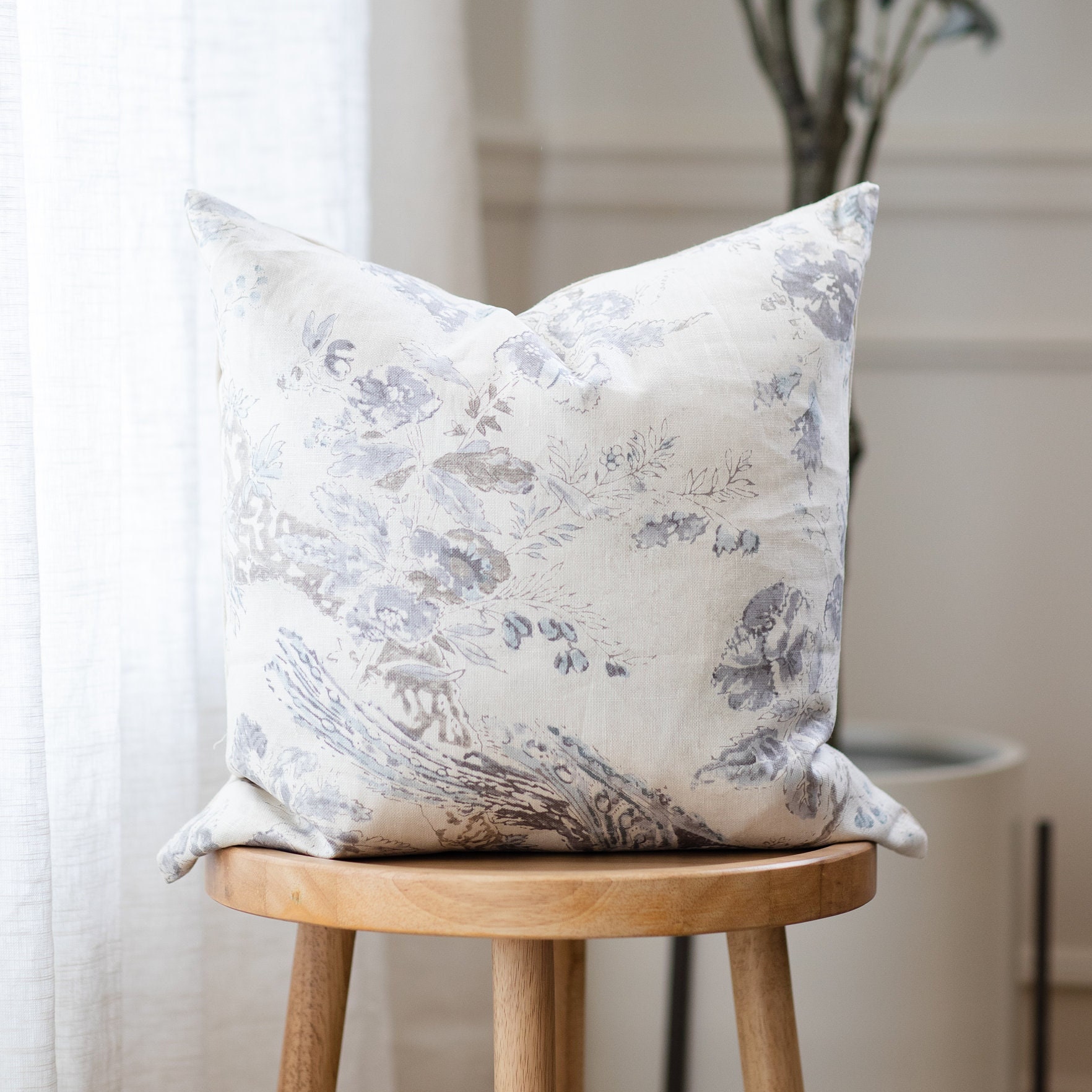 gray floral pillow
