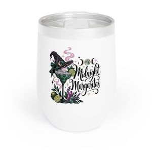 May include: A white tumbler with a lid featuring a graphic of a margarita glass, a witch hat, limes, crystals, and moon phases. The text Midnight Margaritas is written in black script. The design includes purple smoke and small star accents.
