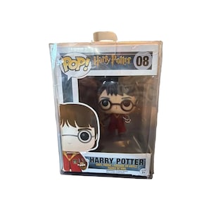 May include: A Harry Potter Funko Pop vinyl figure number 08 inside a clear plastic display box. The packaging features the Pop logo, the character name, and a graphic illustration of Harry Potter wearing glasses and a red robe.