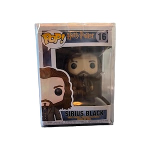 May include: A Funko Pop vinyl figure of Sirius Black from Harry Potter, number 16, encased in its original clear window display box. The box features the character's name, the Harry Potter logo, and a graphic illustration of the figure.