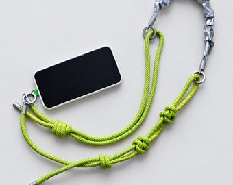 Correa modular llamativa, fabricada con paracord, para teléfono, bolso, cámara, etc.