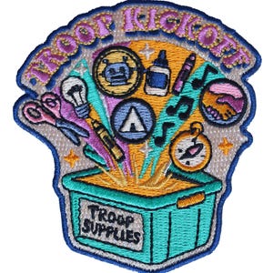 May include: An embroidered patch featuring a teal bin labeled TROOP SUPPLIES with various items emerging from it, including scissors, a lightbulb, a robot, a glue bottle, a tent, musical notes, and a compass. The text TROOP KICKOFF is at the top.