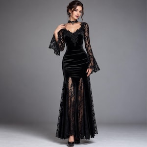 May include: A floor-length black velvet dress featuring long bell sleeves made of intricate lace, a V-neckline with lace trim, a matching lace choker, and a front skirt panel with two vertical slits revealing a sheer lace underlay beneath the velvet.