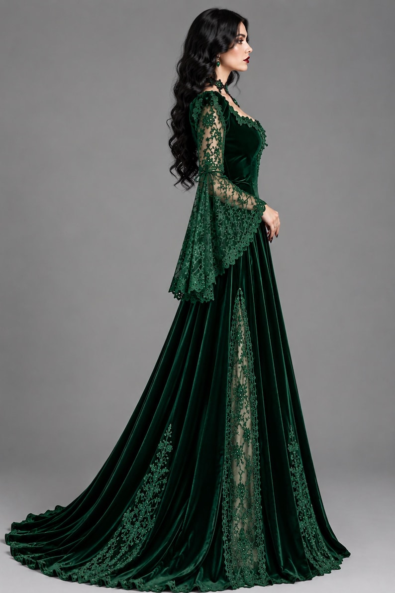 May include: A floor-length dark green velvet gown featuring long flared lace sleeves, a square neckline, and a high side slit that reveals a beige lace panel. The dress is adorned with intricate green lace trim along the sleeves and skirt hem.