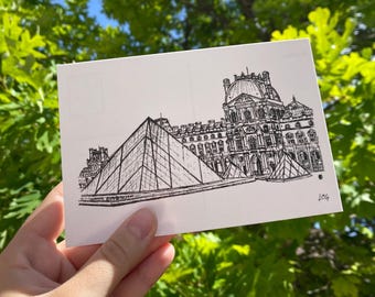 May include: A white rectangular postcard featuring a detailed black ink line drawing of the Louvre Museum in Paris, including its iconic glass pyramid and historic architecture. The artist's initials LCG are visible in the bottom right corner.