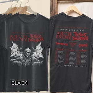May include: A black t-shirt featuring a graphic of a winged skeleton on the front and a tour schedule for Arch Enemy and The Black Dahlia Murder on the back. The text reads Wrath Across North America 2020 and lists various concert dates and locations.