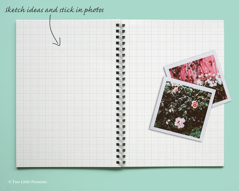 May include: An open notebook with a grid pattern on the pages. Two instant photos of pink flowers are stuck to the right page. The text "sketch ideas and stick in photos" is written at the top of the page.