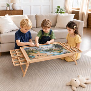 May include: A light-colored wooden jigsaw puzzle table with foldable legs, featuring a central work surface and four pull-out sorting drawers on the sides. The table holds a partially completed landscape puzzle depicting a mountain lake scene.