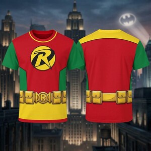 May include: A short-sleeved t-shirt featuring a red torso, green sleeves, and a yellow collar and waist area. The front displays a circular emblem with a black R on a yellow background. A yellow utility belt with pouches is printed across the waist.