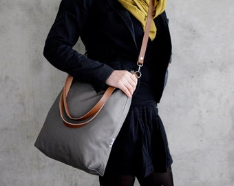 Large canvas shoulder bag with leather straps, zipper and inside pocket, simple handbag made of fabric