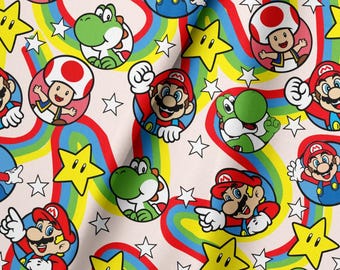 May include: A fabric pattern featuring a repeating print of Mario, Yoshi, and Toad characters inside circular frames, interspersed with yellow stars and wavy rainbow-colored stripes on a light-colored background, creating a vibrant graphic design.