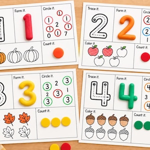 May include: Four educational activity sheets for children featuring numbers one through four. Each sheet includes sections to trace, form with clay, circle, colour, and count objects like pumpkins, apples, leaves, and acorns.