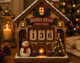 May include: A wooden house-shaped book tracker with a light-up fireplace, a snowman, and a Christmas tree. The sign reads BOOKS READ THIS YEAR above three flip-style number cards displaying 136. The structure features miniature windows and shelves.