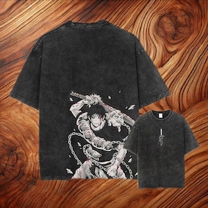 May include: A charcoal gray acid-wash t-shirt featuring a large graphic on the back of an anime character holding a sword and wrapped in chains, with a smaller matching sword graphic printed on the front chest area of the garment.