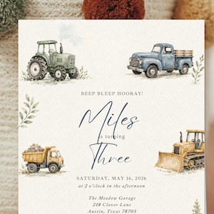 May include: A rectangular invitation card featuring watercolor illustrations of a green tractor, a blue pickup truck, a yellow dump truck, and a yellow bulldozer. The text reads: BEEP BLEEP HOORAY! Miles is turning THREE SATURDAY, MAY 16, 2026 at 2 o'clock in the afternoon The Meadow Garage 218 Clover Lane Austin, Texas 78703.